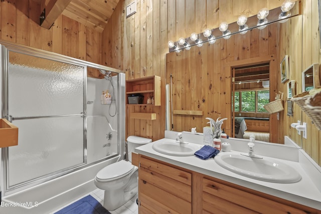 112 Silver St, Lanesborough, MA 01237 - ensuite bathroom with wooden walls, lofted ceiling, double vanity, bath / shower combo with glass door, and tile patterned floors