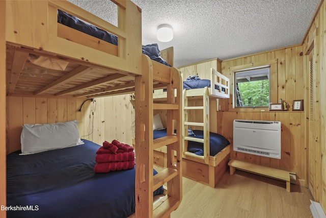 112 Silver St, Lanesborough, MA 01237 - bedroom featuring wood walls, wood finished floors, and heating unit