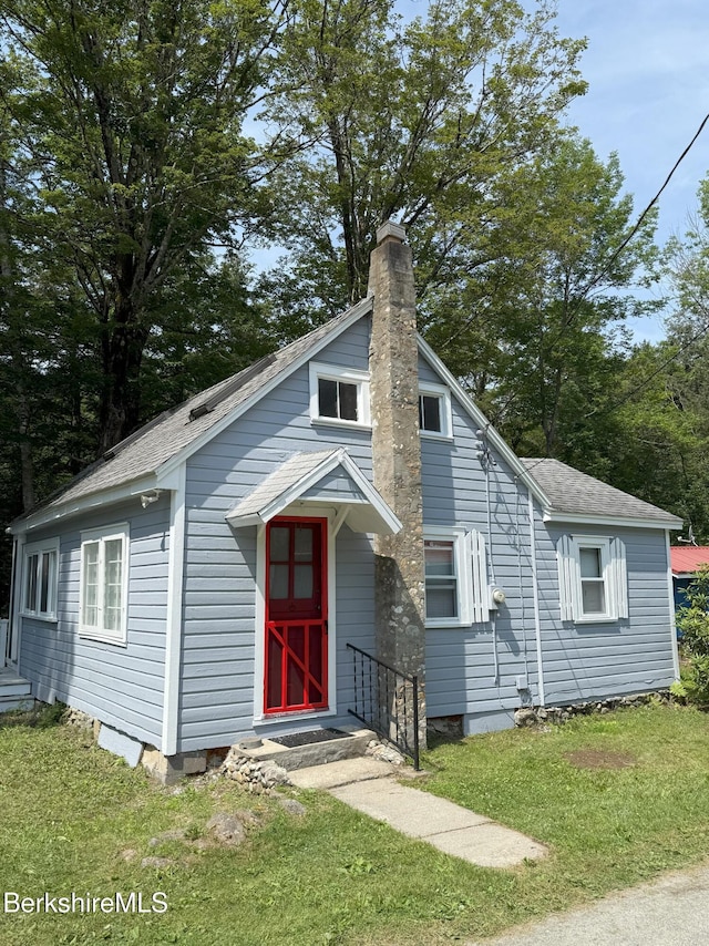 8 Brook Ln, Becket, MA 01223 - bungalow-style house with a chimney, a front lawn, and a shingled roof