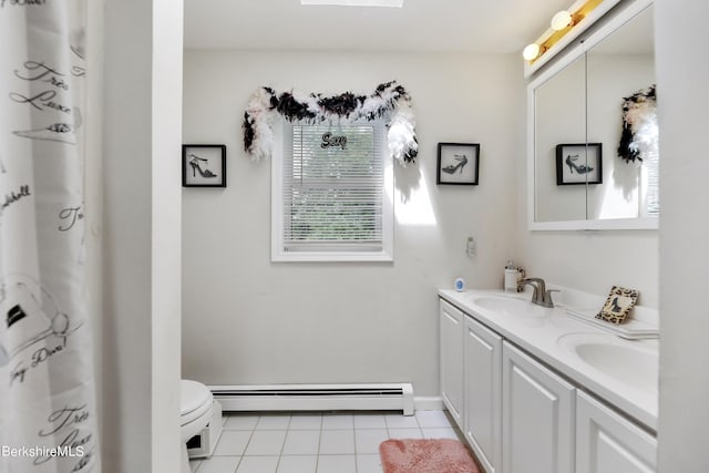 full bathroom featuring a baseboard radiator, double vanity, a sink, and tile patterned floors