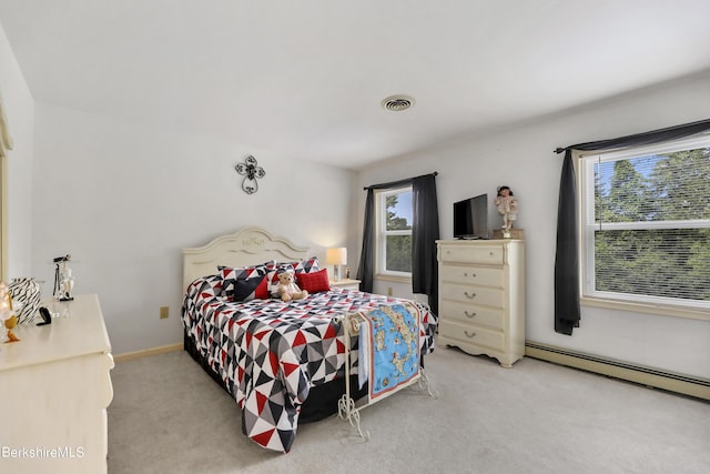 carpeted bedroom with baseboards, visible vents, and baseboard heating