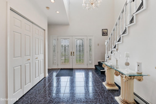 foyer featuring baseboards, stairway, baseboard heating, french doors, and recessed lighting