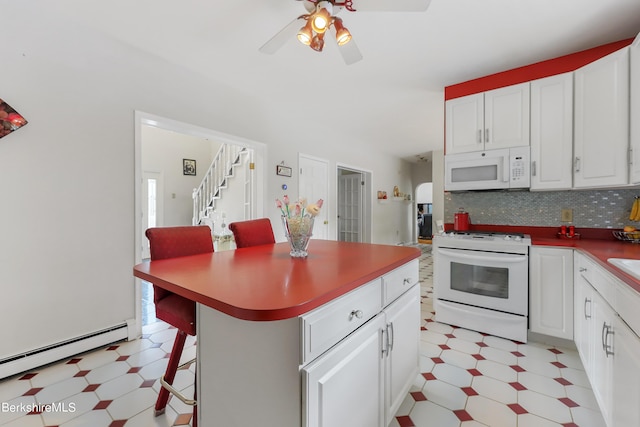 kitchen featuring white appliances, white cabinets, decorative backsplash, light floors, and a kitchen bar