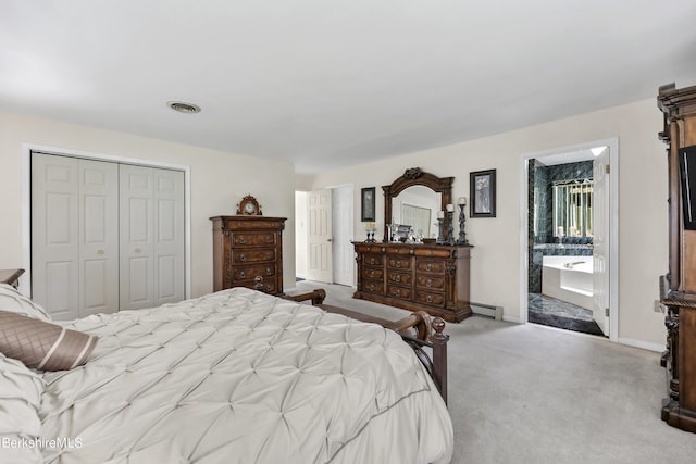 bedroom featuring a closet, visible vents, a baseboard heating unit, carpet flooring, and baseboards