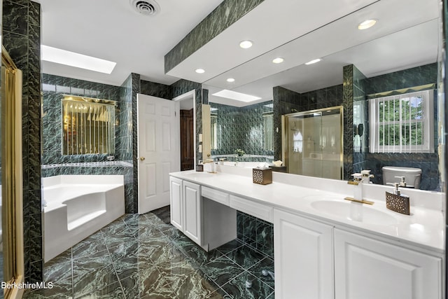 bathroom with marble finish floor, visible vents, a stall shower, a sink, and a bath