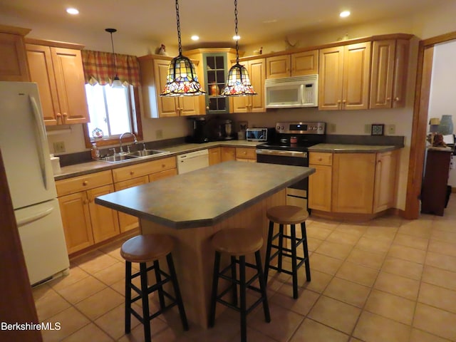 16-18 Hoosac St, Adams, MA 01220 - kitchen featuring stainless steel appliances, a sink, a breakfast bar, dark countertops, and light tile patterned floors