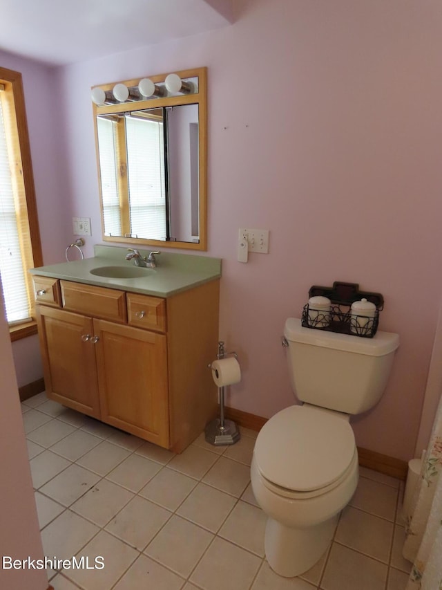 16-18 Hoosac St, Adams, MA 01220 - bathroom with toilet, tile patterned floors, vanity, and baseboards