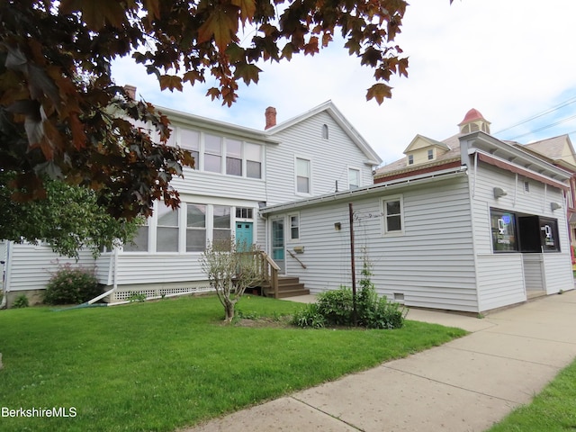 16-18 Hoosac St, Adams, MA 01220 - rear view of property with a yard and a chimney