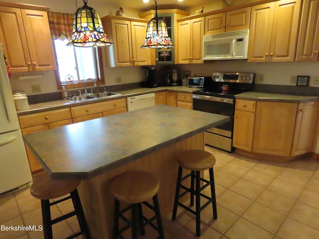 16-18 Hoosac St, Adams, MA 01220 - kitchen with white appliances, a sink, light tile patterned floors, and a kitchen bar