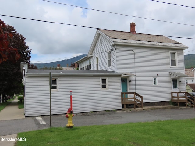 16-18 Hoosac St, Adams, MA 01220 - view of side of home with a chimney