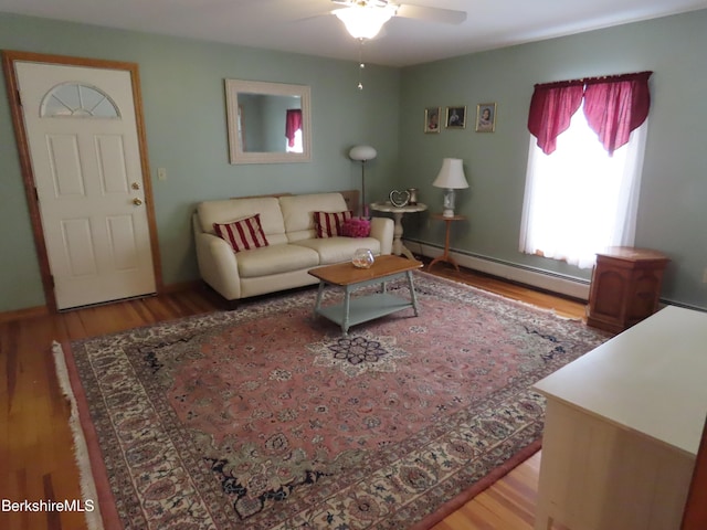 16-18 Hoosac St, Adams, MA 01220 - living room with a baseboard radiator, a ceiling fan, and wood finished floors
