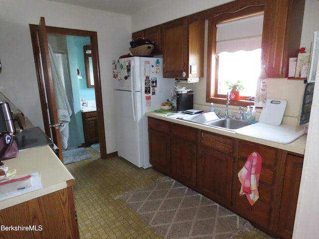 16-18 Hoosac St, Adams, MA 01220 - kitchen with freestanding refrigerator, light countertops, a sink, and light flooring