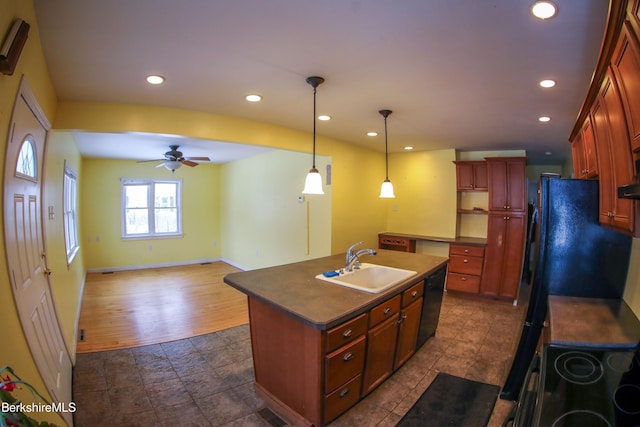 kitchen with a kitchen island with sink, sink, ceiling fan, black dishwasher, and decorative light fixtures