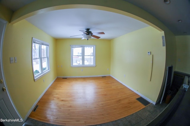 spare room with ceiling fan and light hardwood / wood-style floors