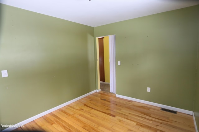 spare room with light wood-type flooring