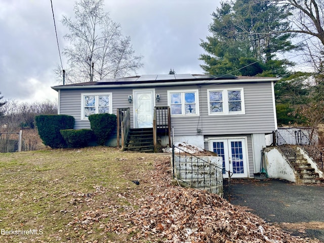 view of front of house with solar panels