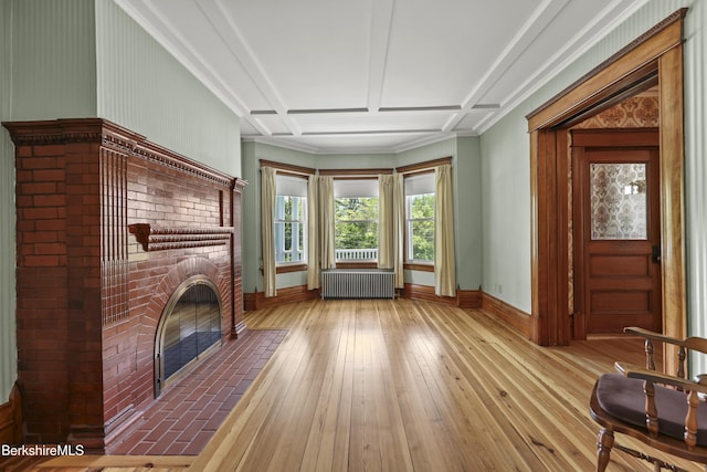855 Massachusetts Ave, North Adams, MA 01247 - unfurnished living room with radiator heating unit, a fireplace, hardwood / wood-style flooring, baseboards, and coffered ceiling