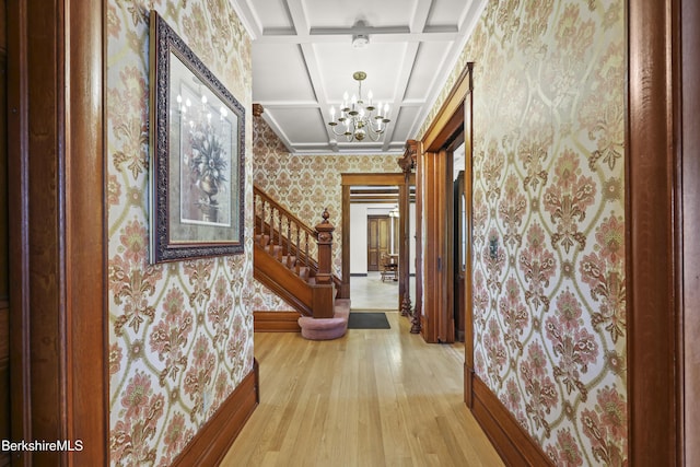 855 Massachusetts Ave, North Adams, MA 01247 - corridor with wallpapered walls, a chandelier, coffered ceiling, stairs, and light wood-style floors