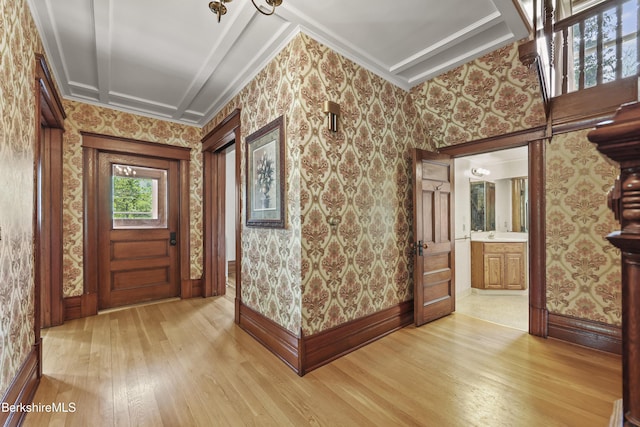 855 Massachusetts Ave, North Adams, MA 01247 - entrance foyer with light wood-type flooring, wallpapered walls, ornamental molding, and baseboards