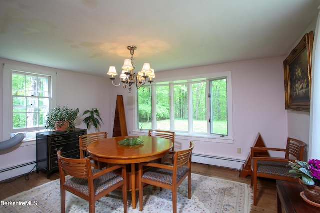 31 Oxbow Rd, Charlemont, MA 01339 - dining area featuring a chandelier, a baseboard radiator, and light wood finished floors
