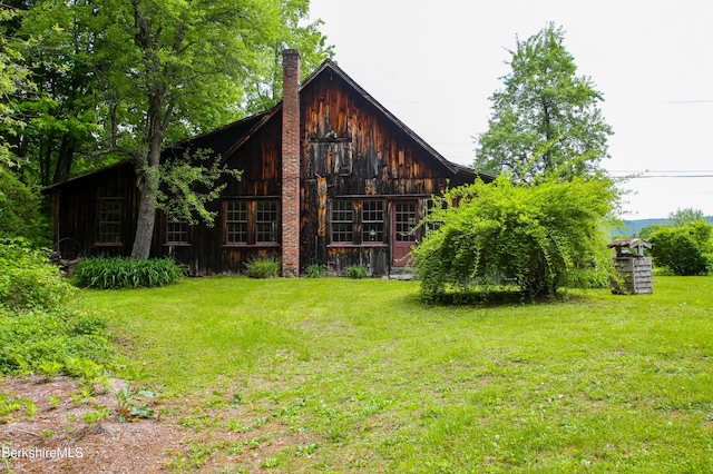 31 Oxbow Rd, Charlemont, MA 01339 - view of property exterior with a yard and a chimney
