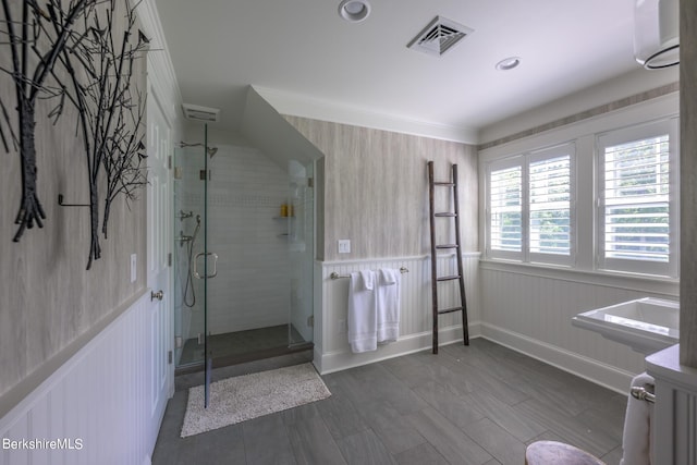 bathroom with hardwood / wood-style flooring, walk in shower, and crown molding