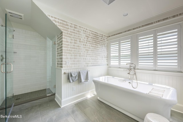 bathroom featuring tile patterned floors, crown molding, and shower with separate bathtub