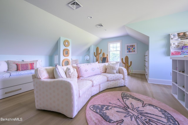 living room with light hardwood / wood-style flooring and lofted ceiling