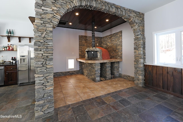 details with appliances with stainless steel finishes and a dry bar