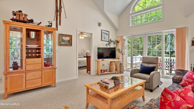 9074 Mountainside Dr, Hancock, MA 01237 - living room with light colored carpet, high vaulted ceiling, and baseboards