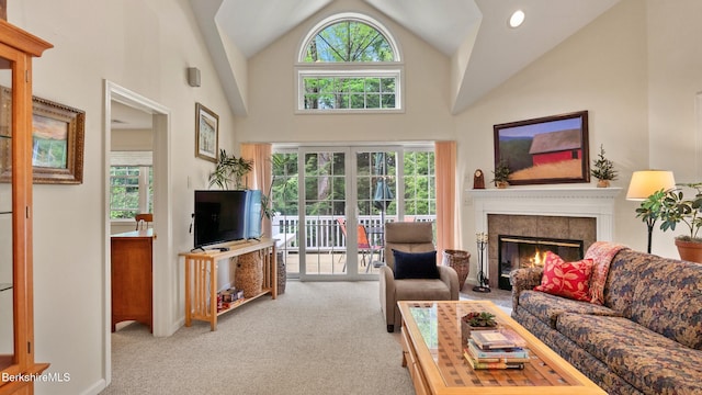 9074 Mountainside Dr, Hancock, MA 01237 - carpeted living room featuring a fireplace, healthy amount of natural light, and high vaulted ceiling