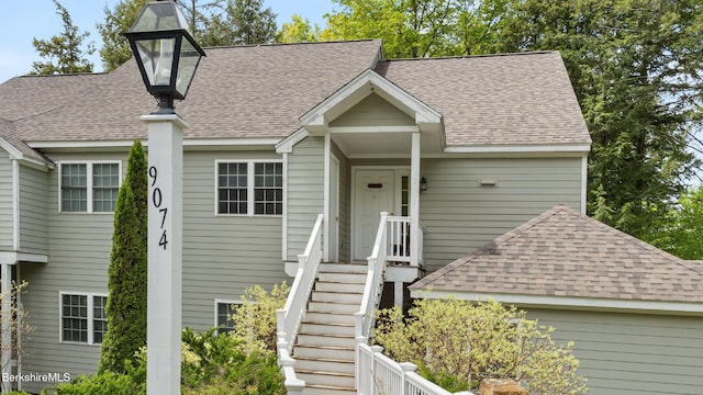 9074 Mountainside Dr, Hancock, MA 01237 - view of front facade featuring roof with shingles