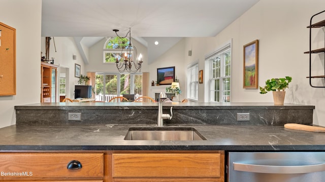 9074 Mountainside Dr, Hancock, MA 01237 - kitchen with a sink, stainless steel dishwasher, lofted ceiling, open floor plan, and a chandelier