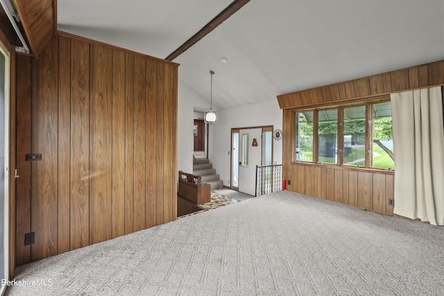 73 Narragansett Ave, Lanesborough, MA 01237 - empty room with carpet, vaulted ceiling, wood walls, and stairs