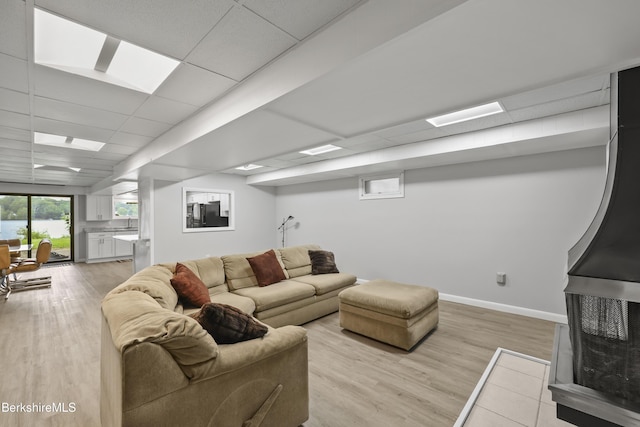 73 Narragansett Ave, Lanesborough, MA 01237 - living area featuring a drop ceiling and light wood-style flooring