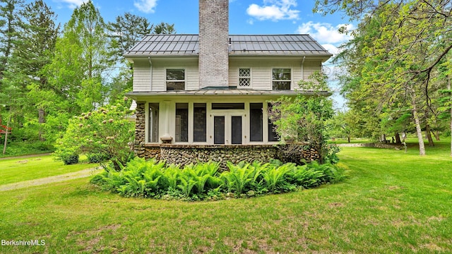 771 W Rd, Sheffield, MA 01257 - back of house with a standing seam roof, metal roof, a chimney, and a yard
