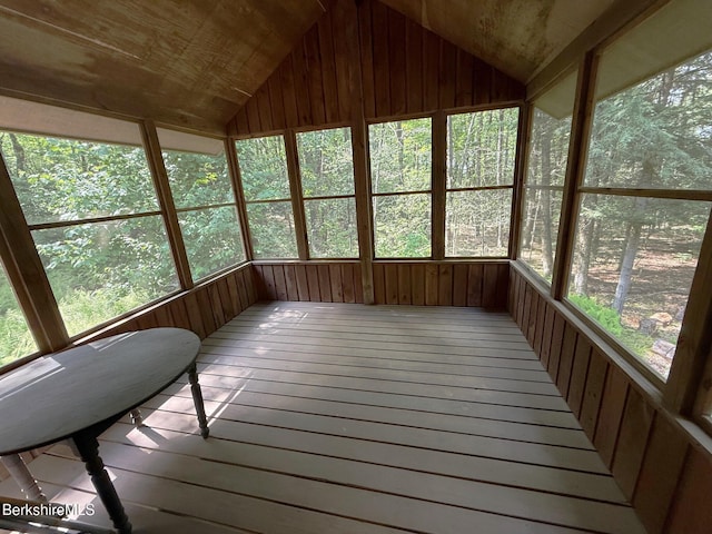841 Moberg Rd, Becket, MA 01223 - unfurnished sunroom featuring vaulted ceiling, wooden walls, and hardwood / wood-style flooring