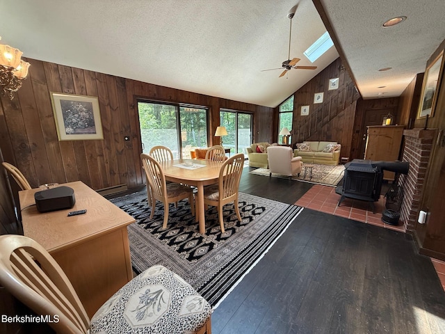 841 Moberg Rd, Becket, MA 01223 - dining space featuring wooden walls, a textured ceiling, hardwood / wood-style floors, a baseboard heating unit, and ceiling fan