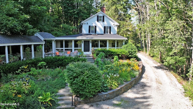 view of front of house with a sunroom