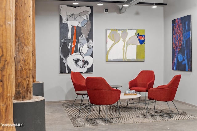 living area with concrete floors
