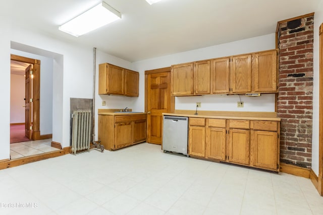 kitchen featuring dishwasher, radiator, and sink