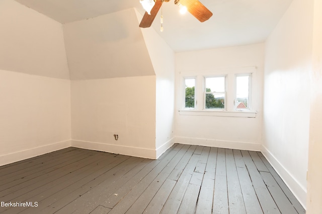 bonus room with ceiling fan, hardwood / wood-style floors, and vaulted ceiling