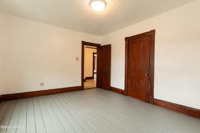 spare room featuring light hardwood / wood-style floors