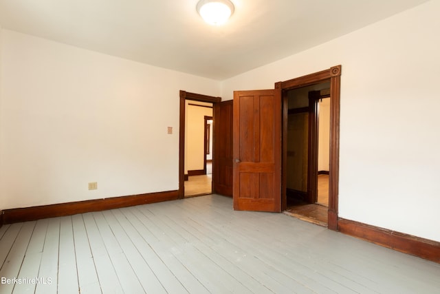 spare room with light hardwood / wood-style flooring