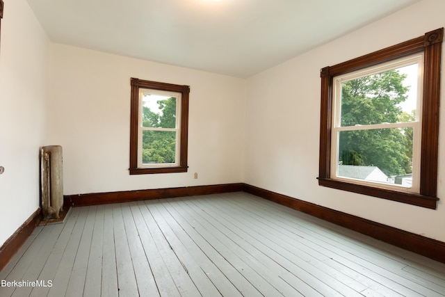 empty room with hardwood / wood-style floors