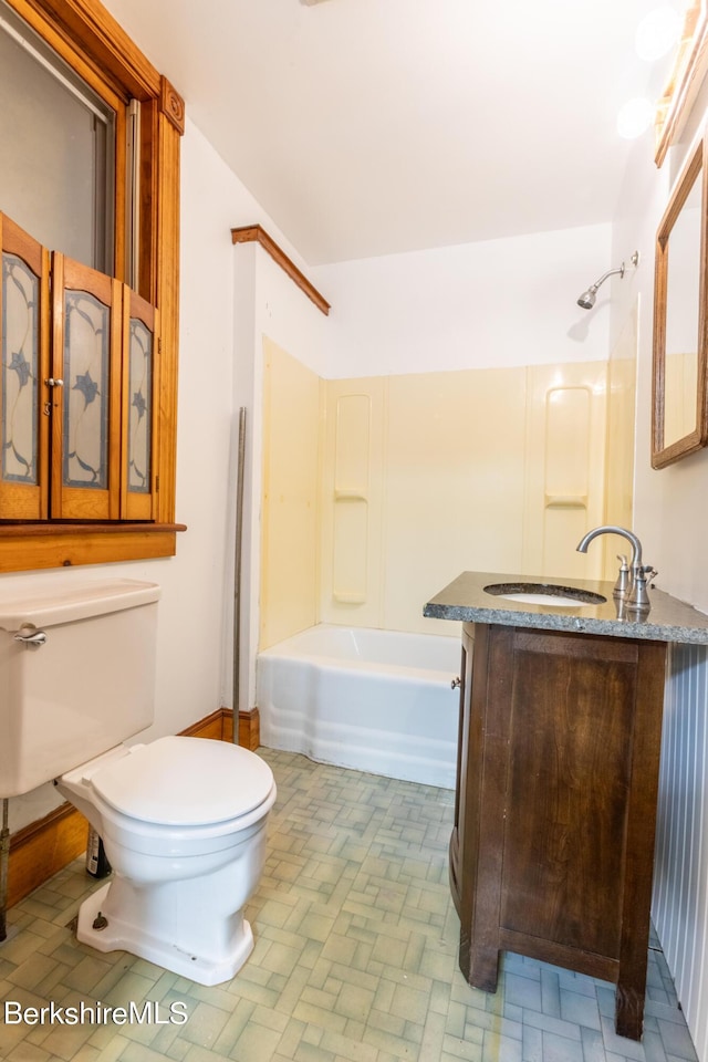 full bathroom with vanity, toilet, and washtub / shower combination