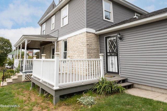 view of exterior entry featuring a porch