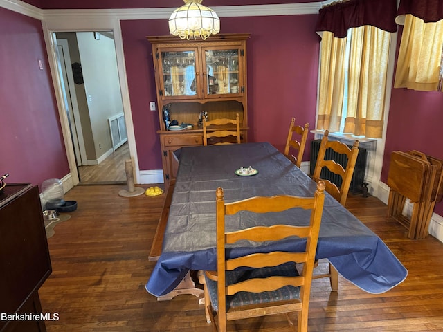 145 Bartlett Ave, Pittsfield, MA 01201 - dining area with wood finished floors, a chandelier, baseboards, and ornamental molding