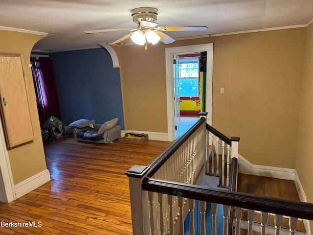 145 Bartlett Ave, Pittsfield, MA 01201 - staircase with arched walkways, a ceiling fan, hardwood / wood-style flooring, baseboards, and crown molding