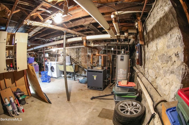 145 Bartlett Ave, Pittsfield, MA 01201 - unfinished below grade area featuring water heater, washer and clothes dryer, a heating unit, and a sink